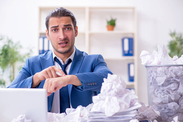 Businessman rejecting new ideas with lots of papers - Photo, image