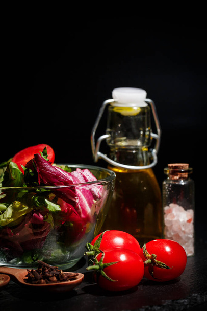 Vegetables for diet, different spices on a black background - Zdjęcie, obraz