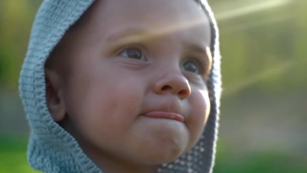 Cute portrait of little baby boy playing in park or green garden. Lovely son, family, toddler concept. - Footage, Video