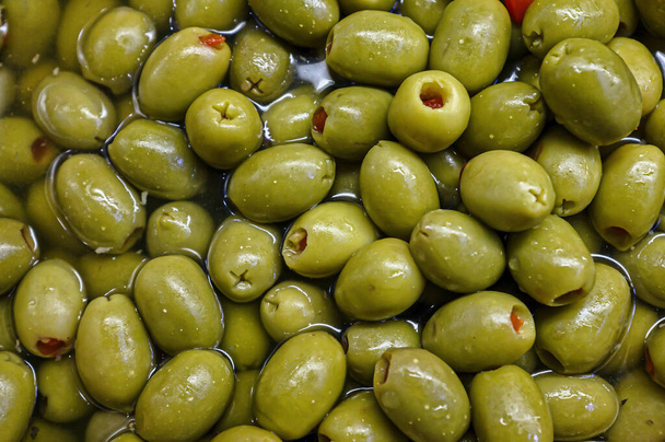 Close up of some Pitted and Seasoned green Olives - Photo, Image