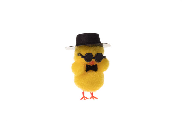 Decorative small easter chicken with glasses and hat, isolated on white background. - Photo, Image