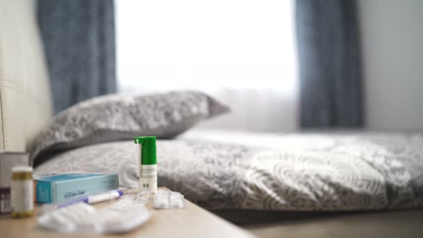 Medicine On Bedside Table. Multiple pills, capsules in blisters and spray in bedroom - Footage, Video