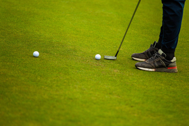 Player during a golf game during a hit - Fotó, kép