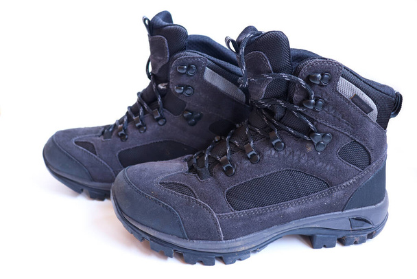 pair of grey hiking boots on a white background. - Photo, Image