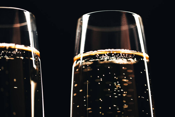 Two glasses of champagne on black stylish background. Place for text. Festive concept. - Fotografie, Obrázek
