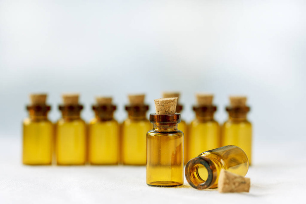Amber-colored pharmaceutical vials with cork. Selective focus. Copy space - Photo, image