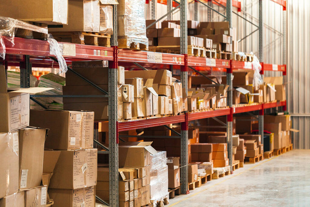 Modern warehouse shelves with pile of cardboard boxes - Φωτογραφία, εικόνα
