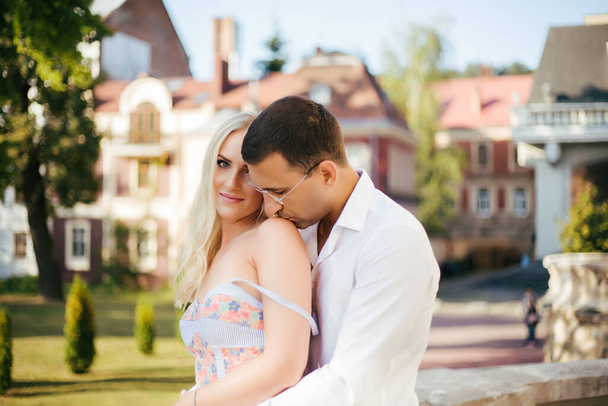 man kisses womans shoulders, couple in love - Fotografie, Obrázek
