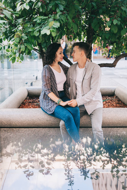 couple engaged, love story, walk around the city at sunset - Foto, Imagen