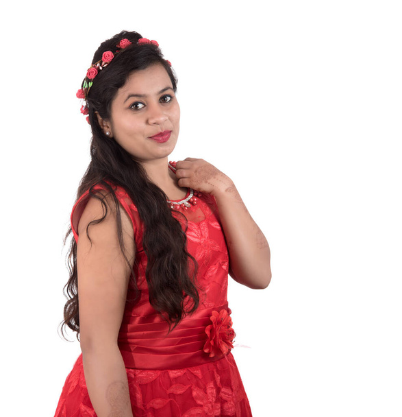 Young girl in red dress posing on white background - Foto, immagini
