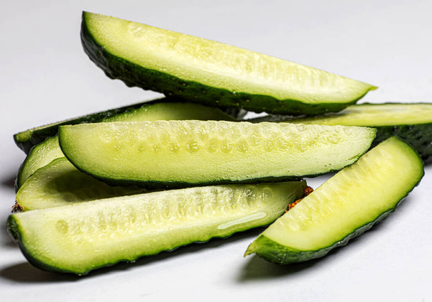 juicy slices of cucumber isolated on white - Photo, Image