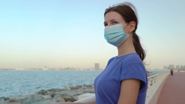 girl in medical mask with sea view  - Footage, Video