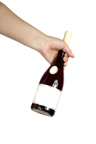 vrouwelijke hand met een fles rode wijn op een witte achtergrond - Foto, afbeelding