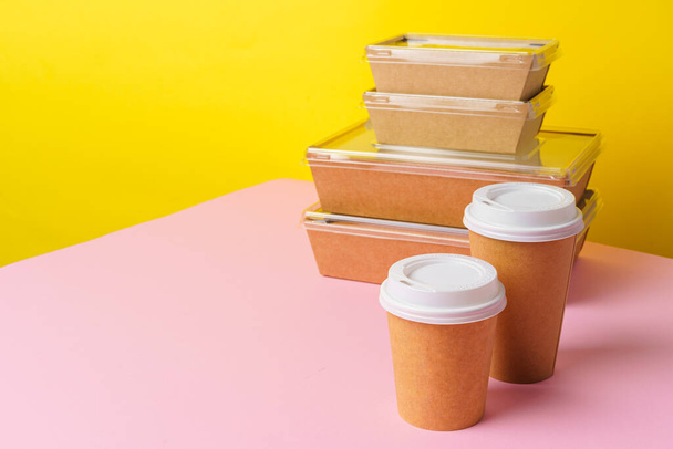 Takeaway food concept. Some packed food in container with coffee cup - Foto, Bild
