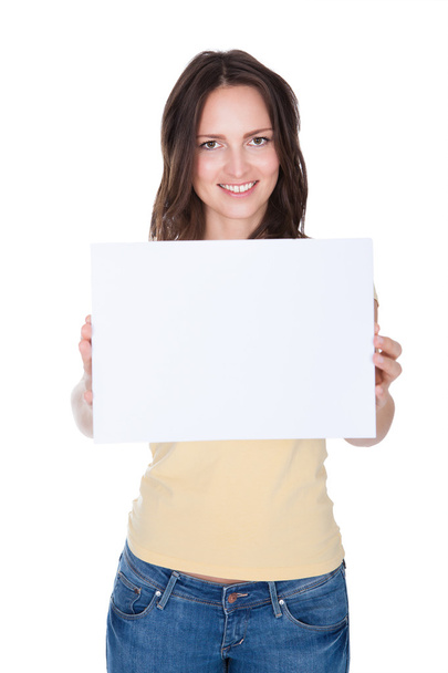 Smiling Woman Holding Placard - Foto, afbeelding