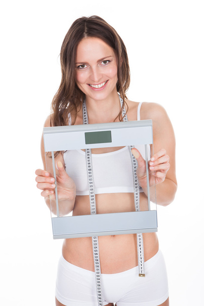 Slim Young Woman Holding Weight Scale - Foto, imagen