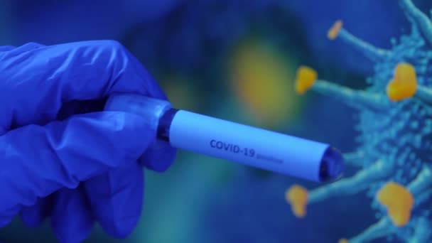 hand holding beaker with coronavirus blood test - Video, Çekim