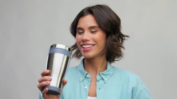 woman with thermo cup or tumbler for hot drinks - Materiał filmowy, wideo