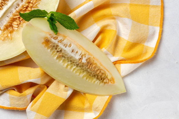 Fresh assortment melon with mint  on white background. Vegan food concept.Healthy food - Φωτογραφία, εικόνα