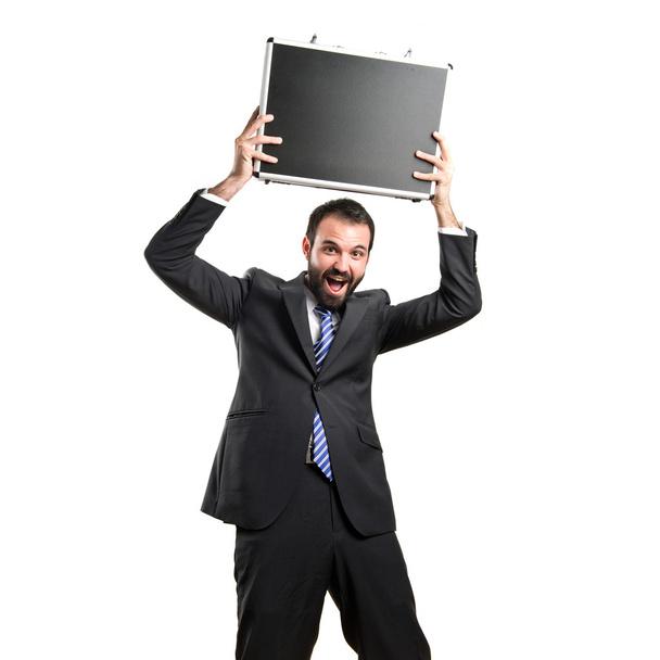 Young businessman with his briefcase over white background - Foto, Imagem