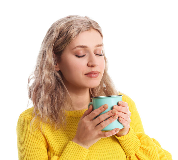 Beautiful young woman with cup of hot chocolate on white background - Photo, Image