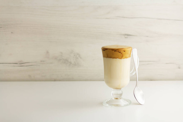 Dalgona coffee. Trendy korean cold drink with foam and milk - 写真・画像