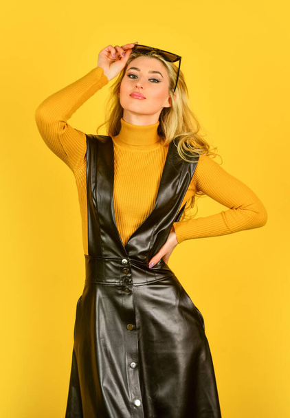 Fashion portrait. Merging style with elegance. Sexy girl. Sexy woman. Trendy clothes. Stylish blonde woman in Fashionable woman in tight leather latex dress. Sexy fashion model. casual outfit - Фото, изображение
