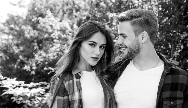 Happy together. Couple in love. Enjoying each other. Man hipster and pretty woman in love. Summer vacation. Fall in love. Pure feelings. Romantic date concept. Cuddling with darling. Beautiful people - Фото, изображение