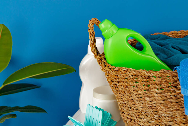 Bottle of detergent whith washing machine, indoors - Foto, Imagen