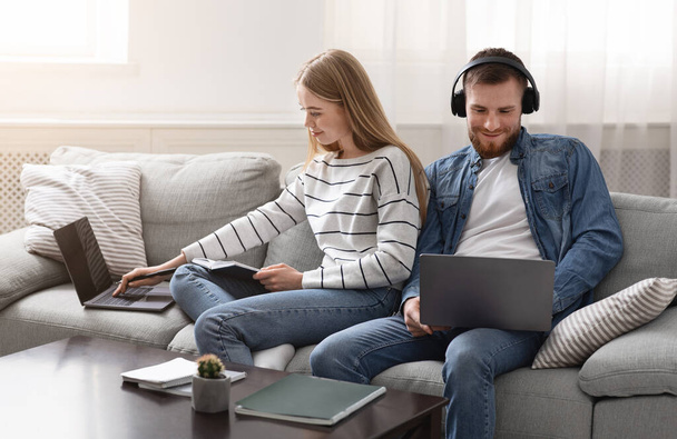 Millennial couple spending time with gadgets online - Φωτογραφία, εικόνα