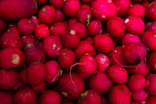 A close-up of radishes for sale on a mark. top view - Φωτογραφία, εικόνα