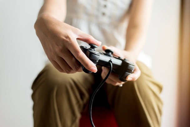 Close up of hands woman playing video games at home,Women holding joystick - Foto, Bild