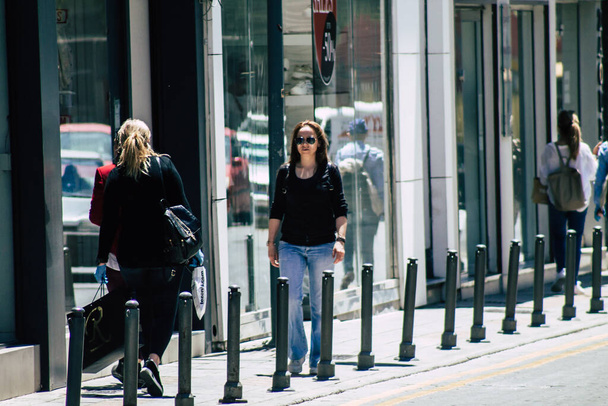 Limassol Cyprus May 06, 2020 View of unidentified people walking in the streets of Limassol in the afternoon during the coronavirus outbreak - 写真・画像
