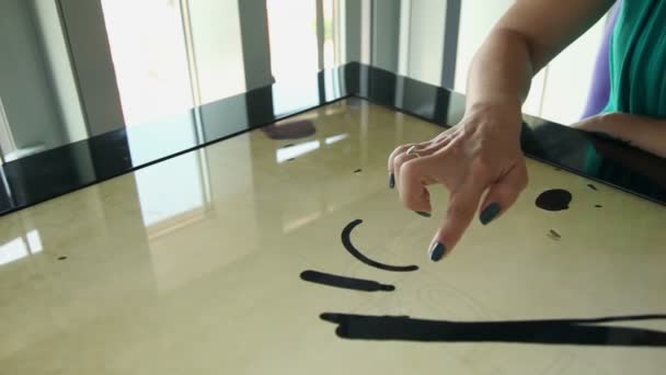 Hand drawing love heart on touch screen and jumps away - Footage, Video