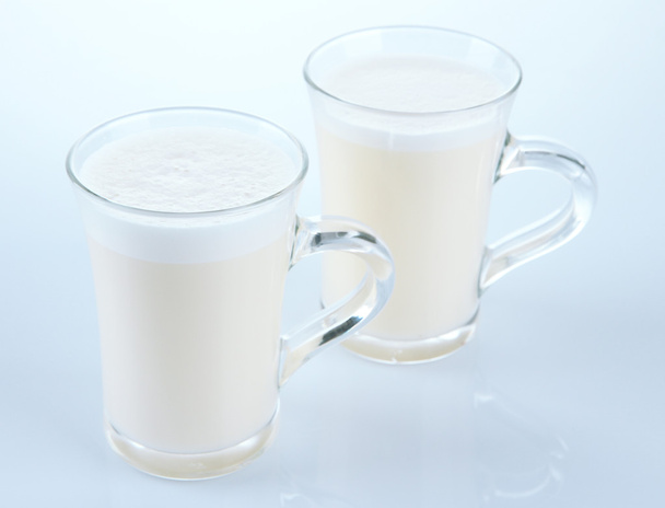 Cups of eggnog isolated on white - 写真・画像