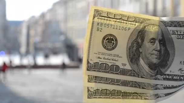 Three hundred dollar bills on blurred background of european old ancient street - Footage, Video