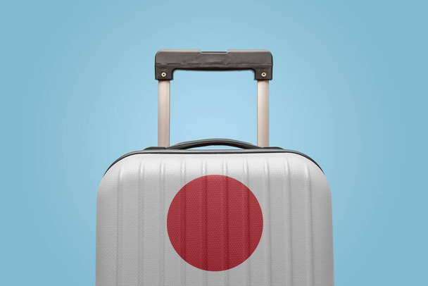 Suitcase with Japanese flag design travel Asia concept. - Foto, imagen