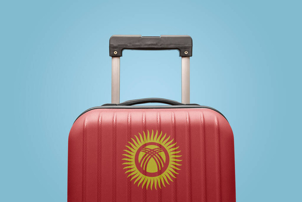 Suitcase with Kyrgyzstan flag design travel Asia concept. - Photo, Image