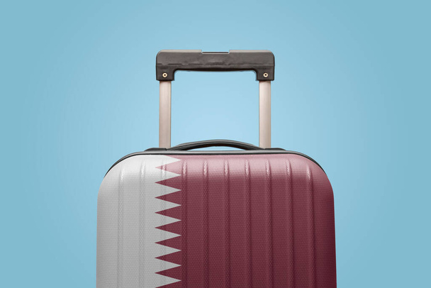 Suitcase with Qatari flag design travel Asia concept. - Fotó, kép