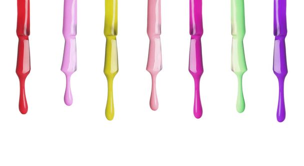 Set of different nail polishes dripping on white background - 写真・画像
