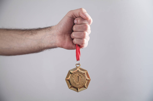 Hand showing medal. Sport, Winner, Success - Photo, Image