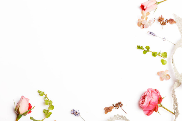 Festive flower composition on the white background. Overhead view - Fotó, kép