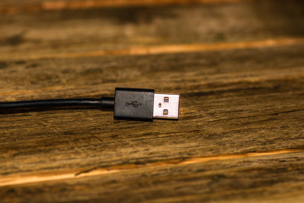 Close up of black USB cable isolated, cable USB connection. - Photo, Image
