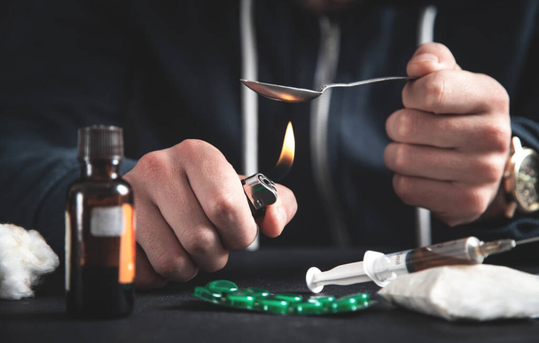 Drug addict prepares heroin. Addiction - Photo, Image