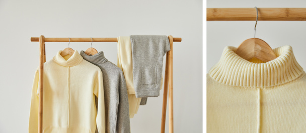 collage of beige and grey knitted soft sweaters and pants hanging on wooden hangers isolated on white - Photo, Image
