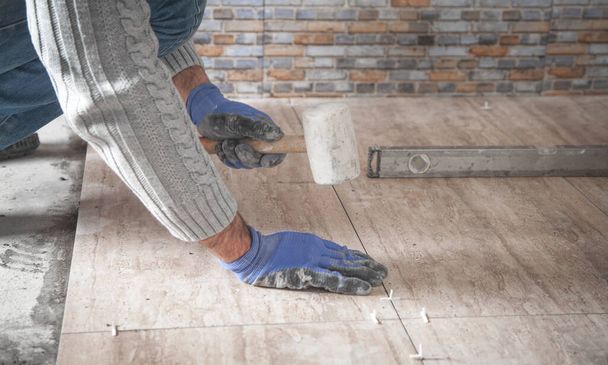 Laying floor ceramic tile. Renovating the floor - Photo, Image