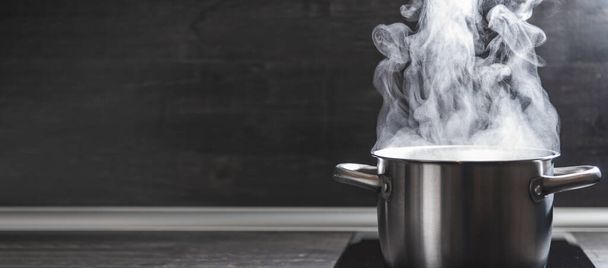 Dense steam coming out the saucepan with freshly cooked food, copy space. - Fotografie, Obrázek
