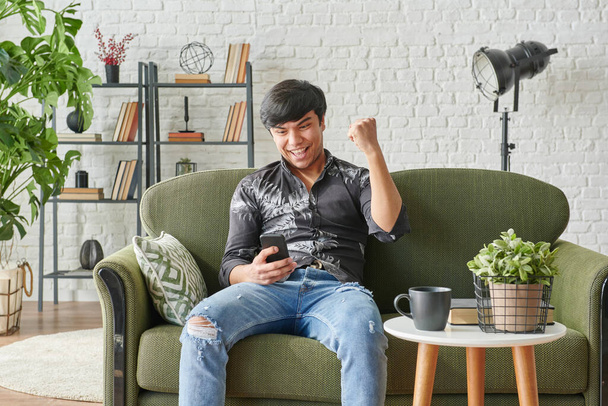 Man playing game, winner and lost concept, living at home style. - Photo, Image