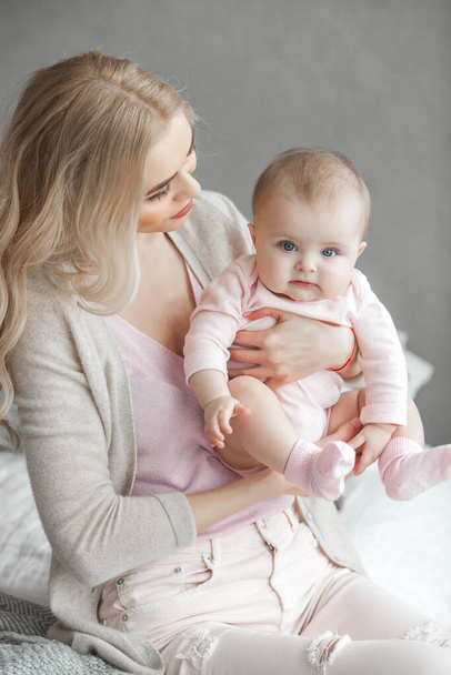 Young mother with little baby. Mommy holding her cute child. Maternity concept. - Valokuva, kuva