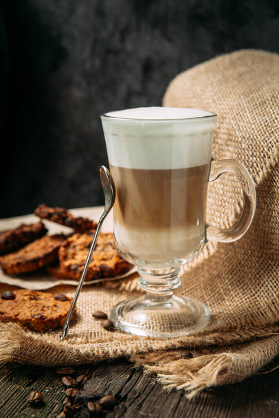 Latte Macchiato with cookies on the wooden table - Foto, immagini